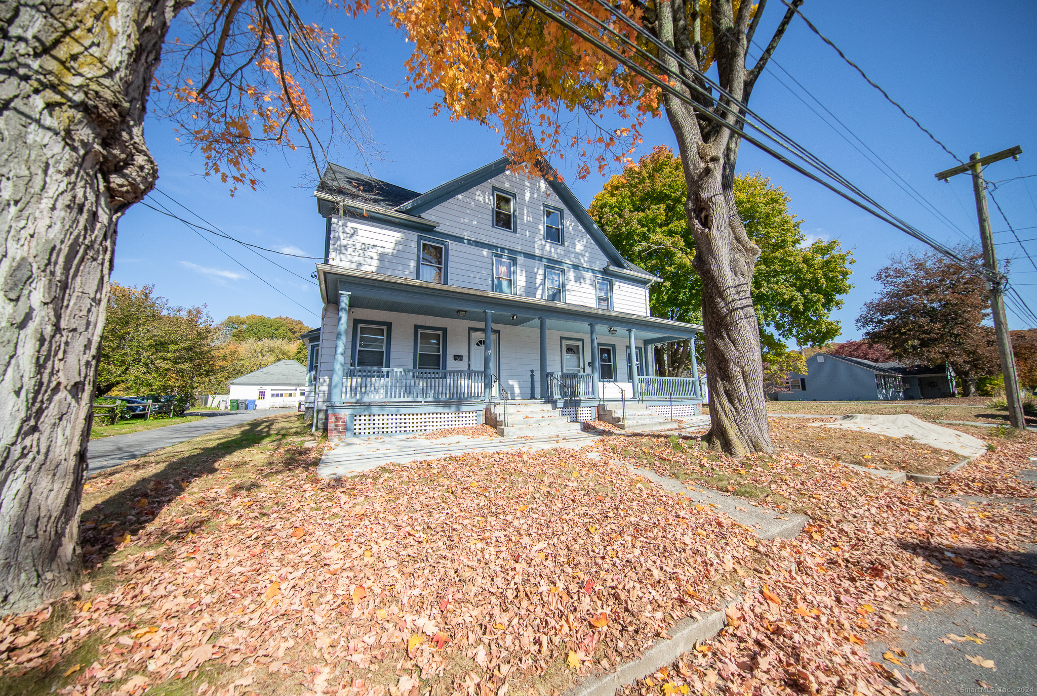 a front view of a house with a yard and porch