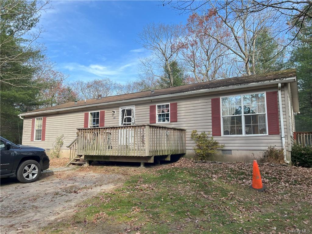 Manufactured / mobile home with a wooden deck