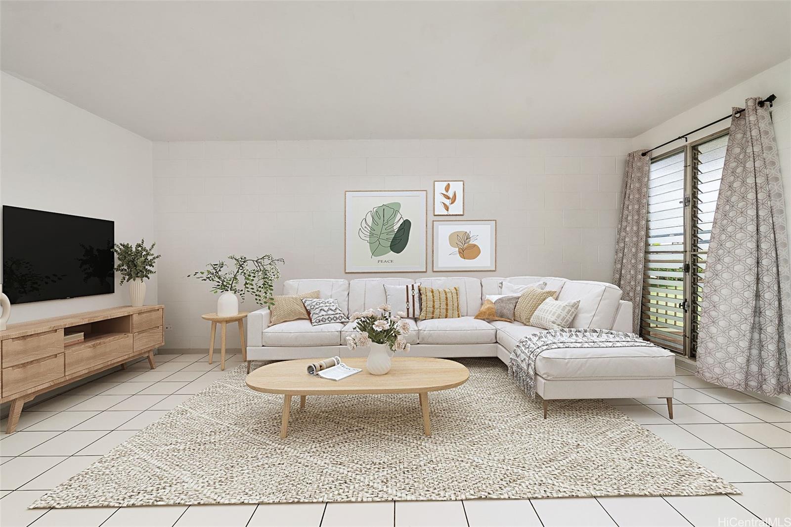 a living room with furniture and a flat screen tv