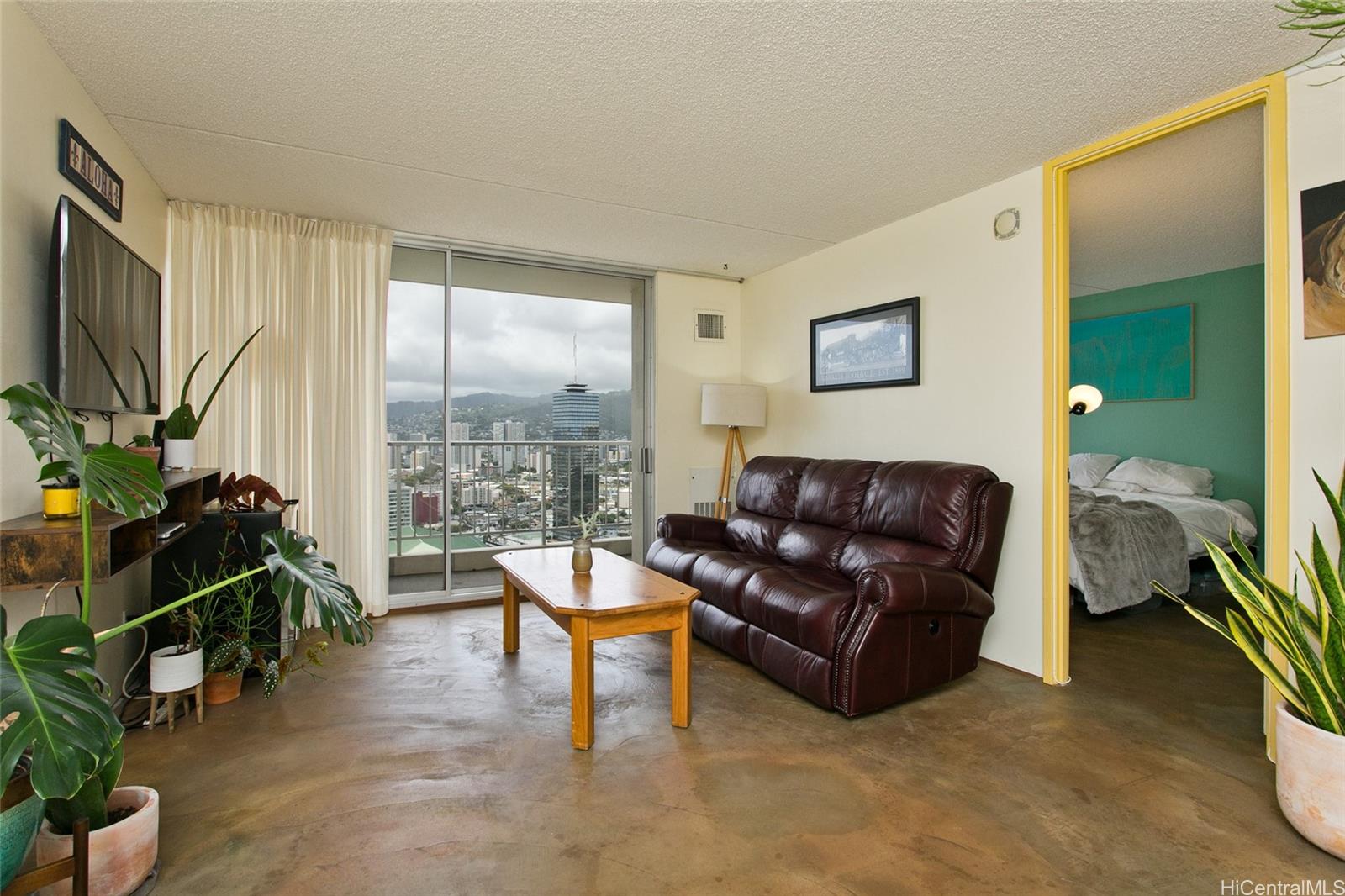 a living room with furniture and a flat screen tv