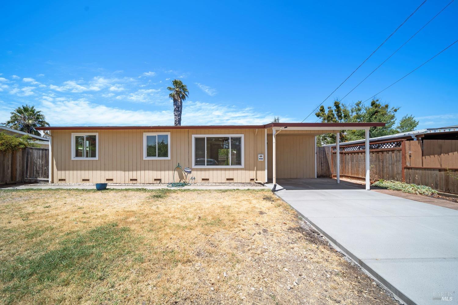 front view of a house with a patio