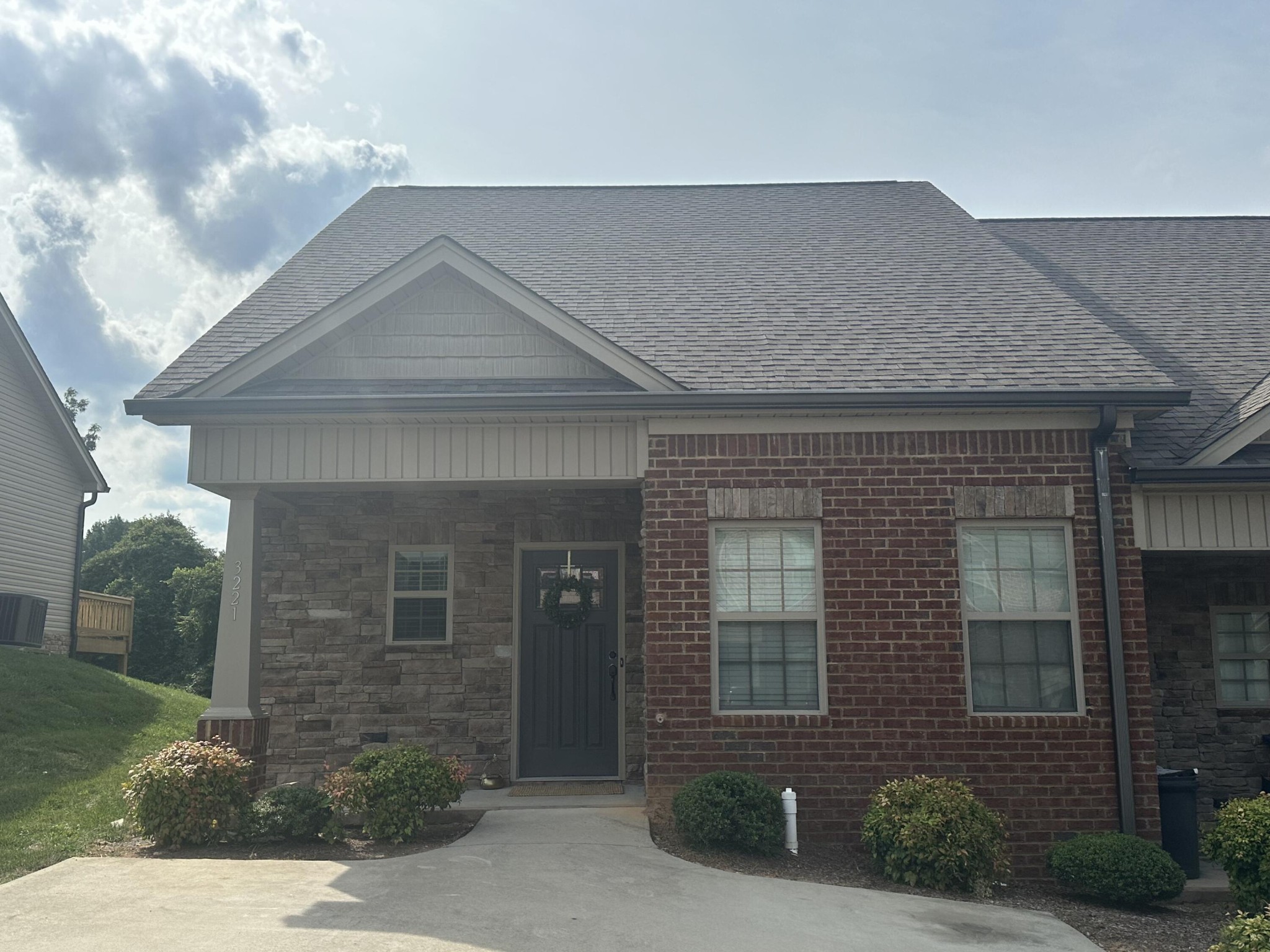 a front view of a house with a yard