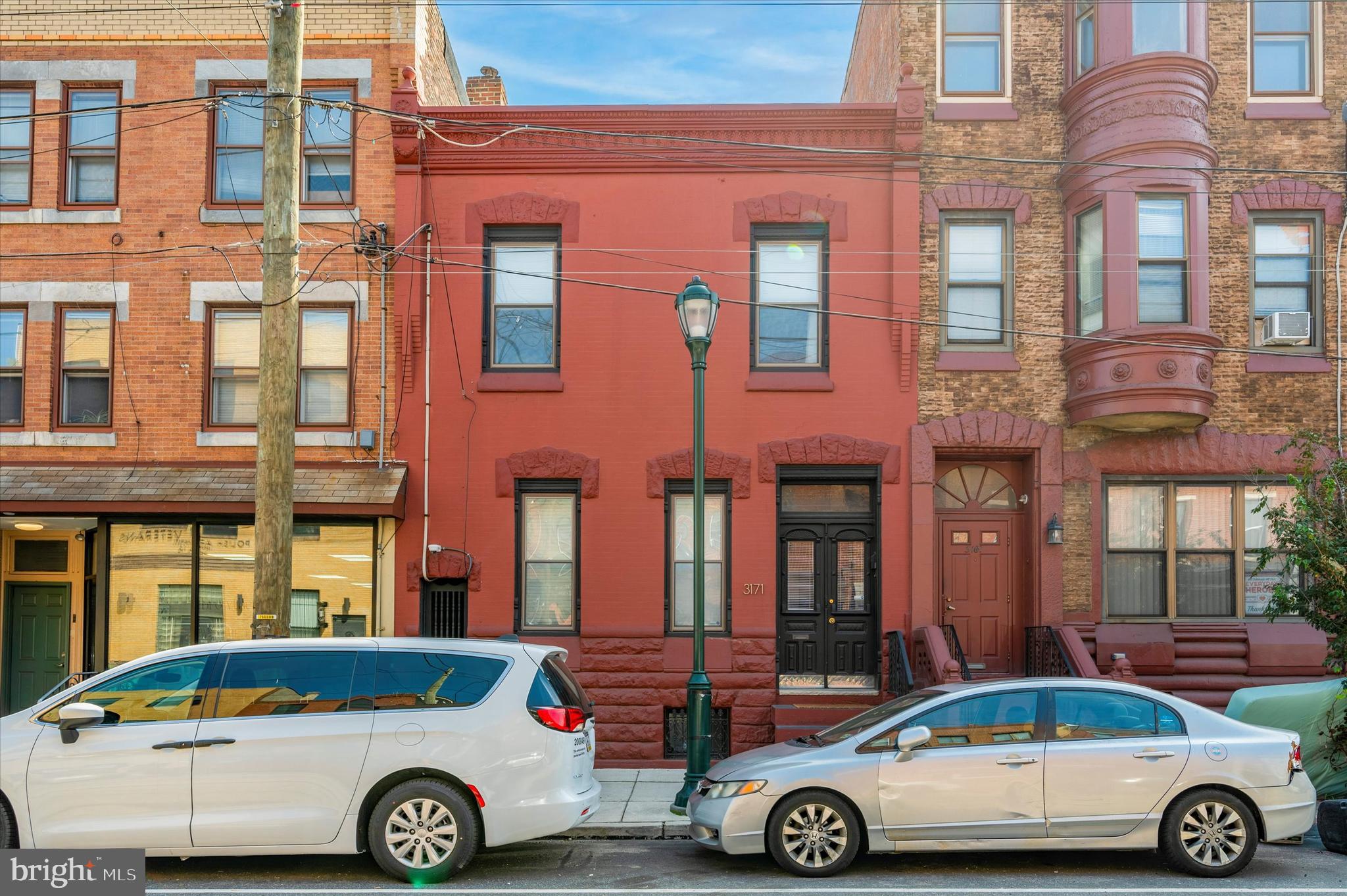 a front view of a house with parking space