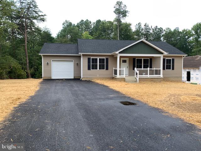 a front view of a house with yard