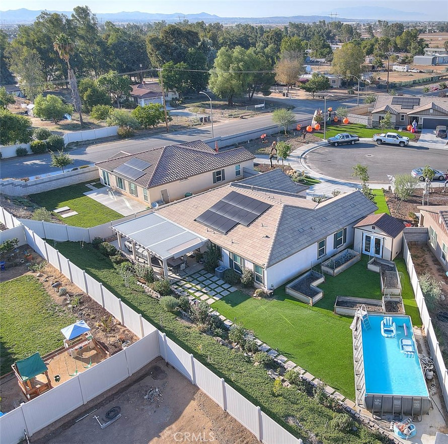 an aerial view of a house with a garden