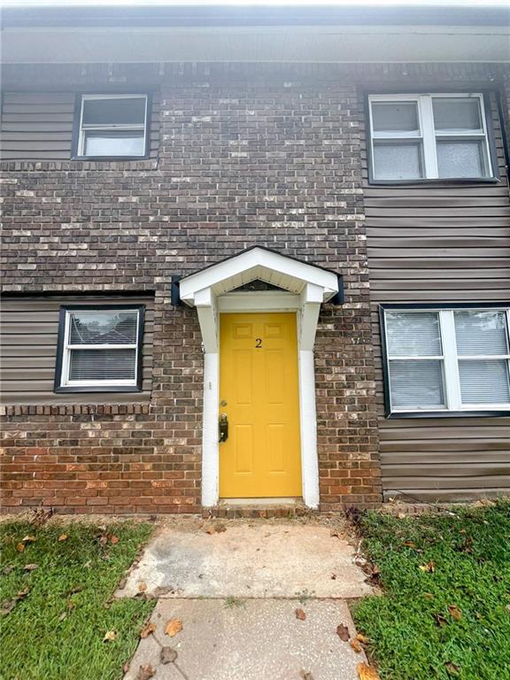 a front view of a house with yard