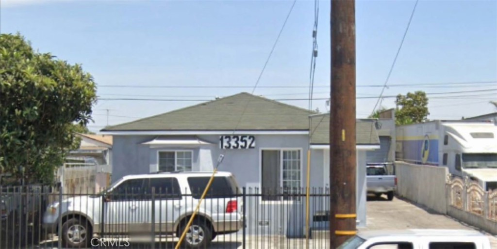 a front view of a house with parking space