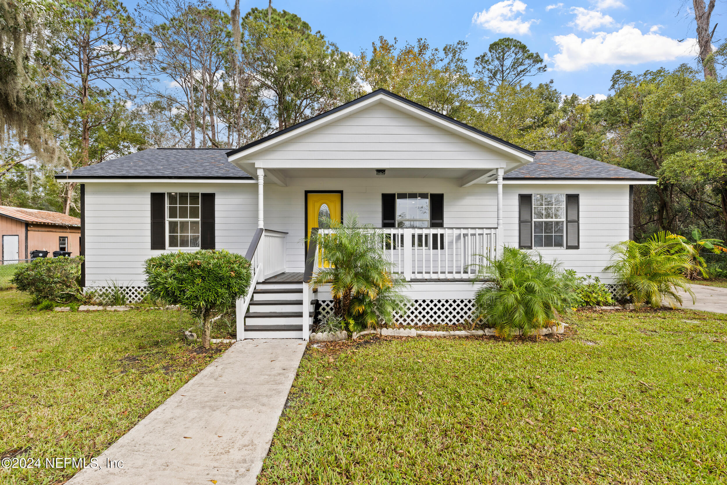 front view of a house with a yard