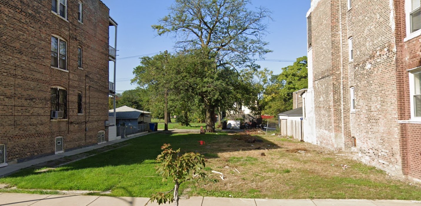 a view of a backyard with a garden