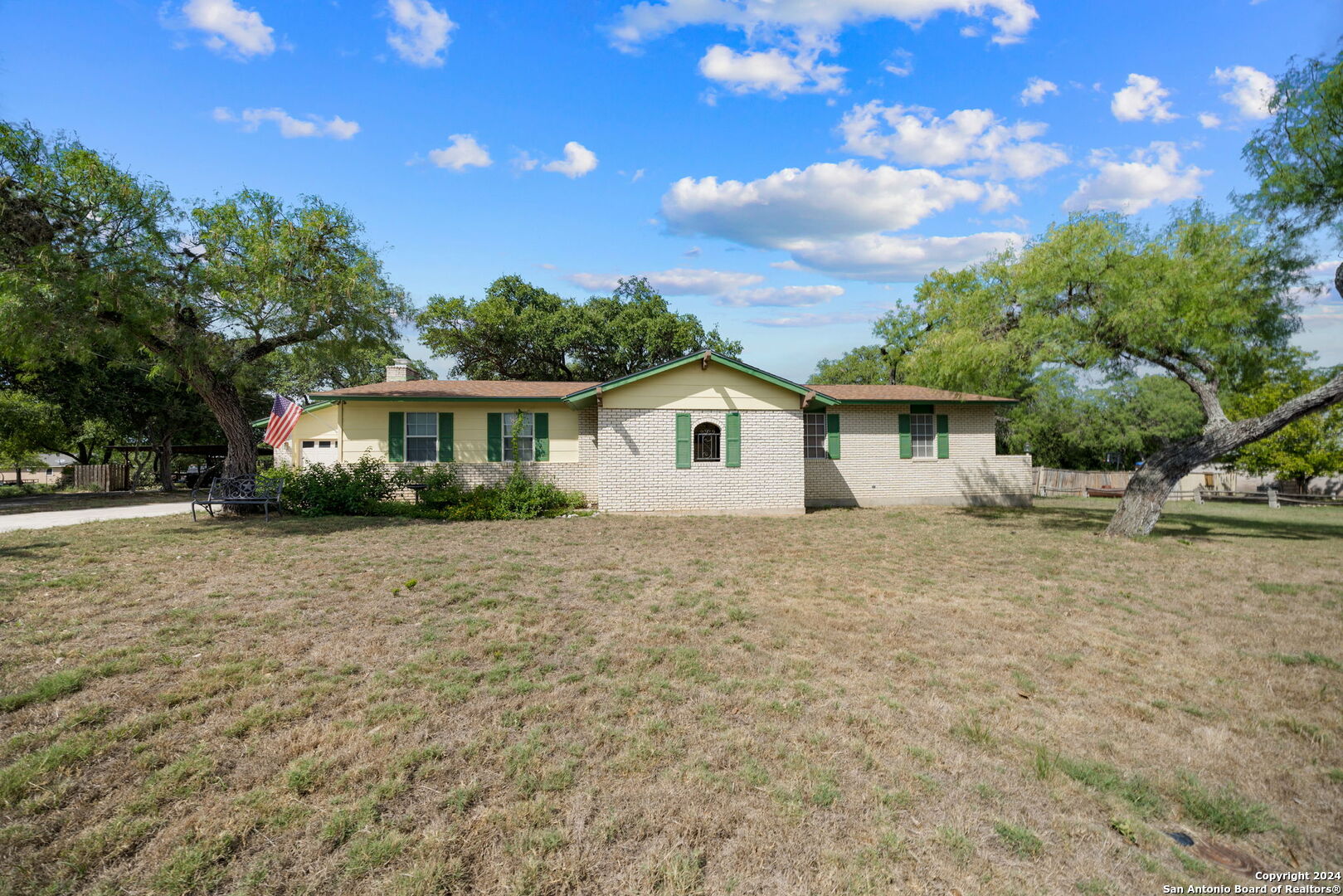 a view of a house with a yard