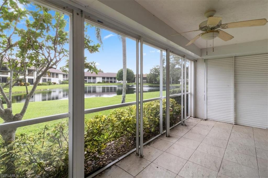 a view of a porch with a ocean from a ceiling fan