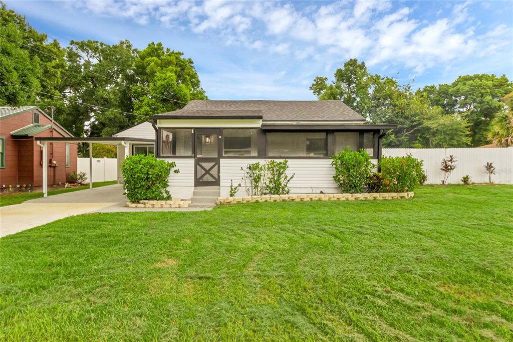 front view of a house with a yard