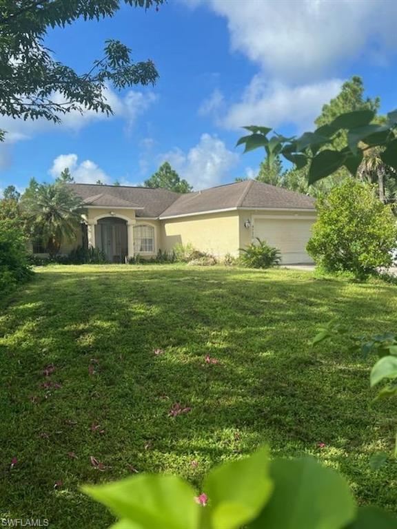 a view of a house with a big yard