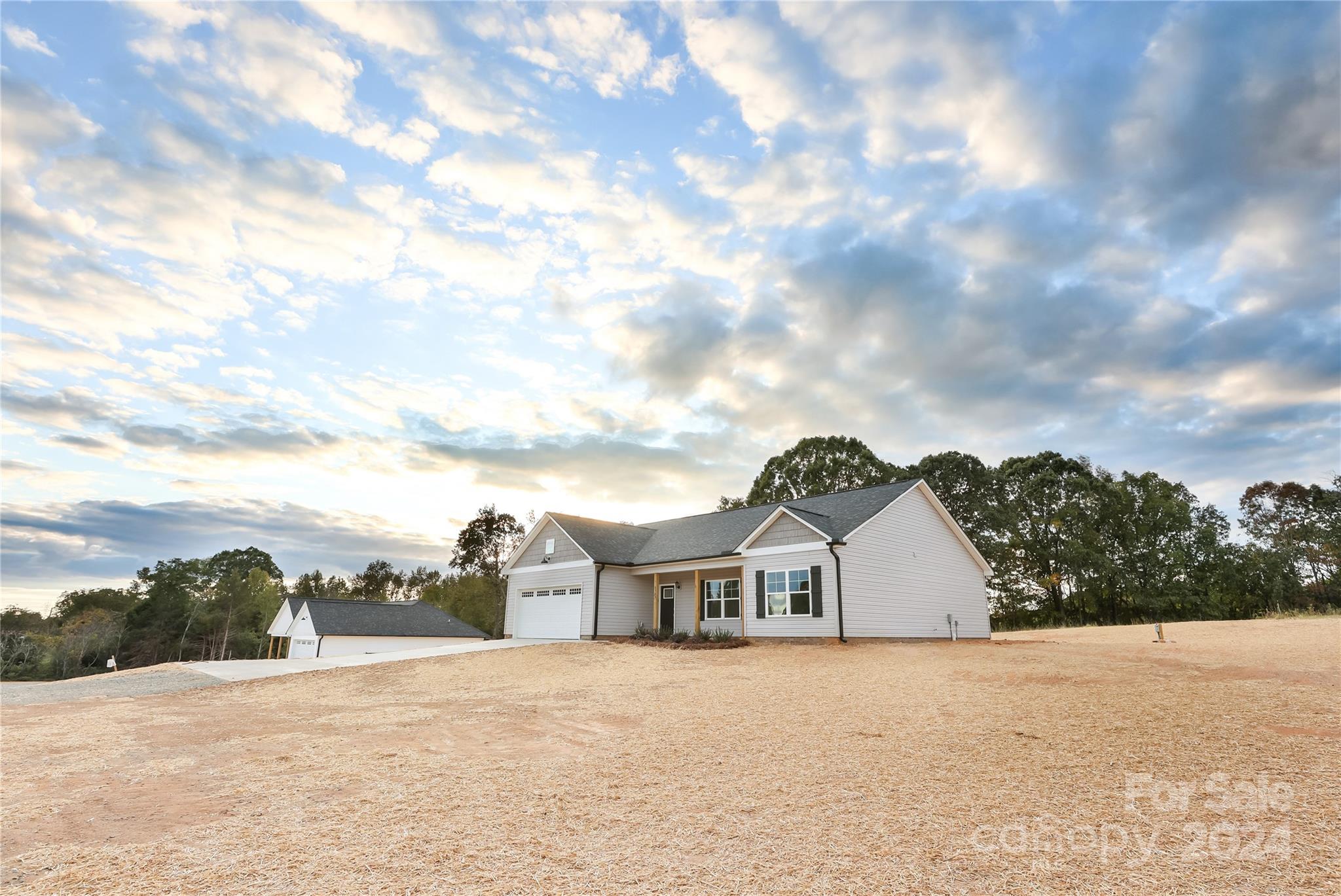 a view of a house with a big yard