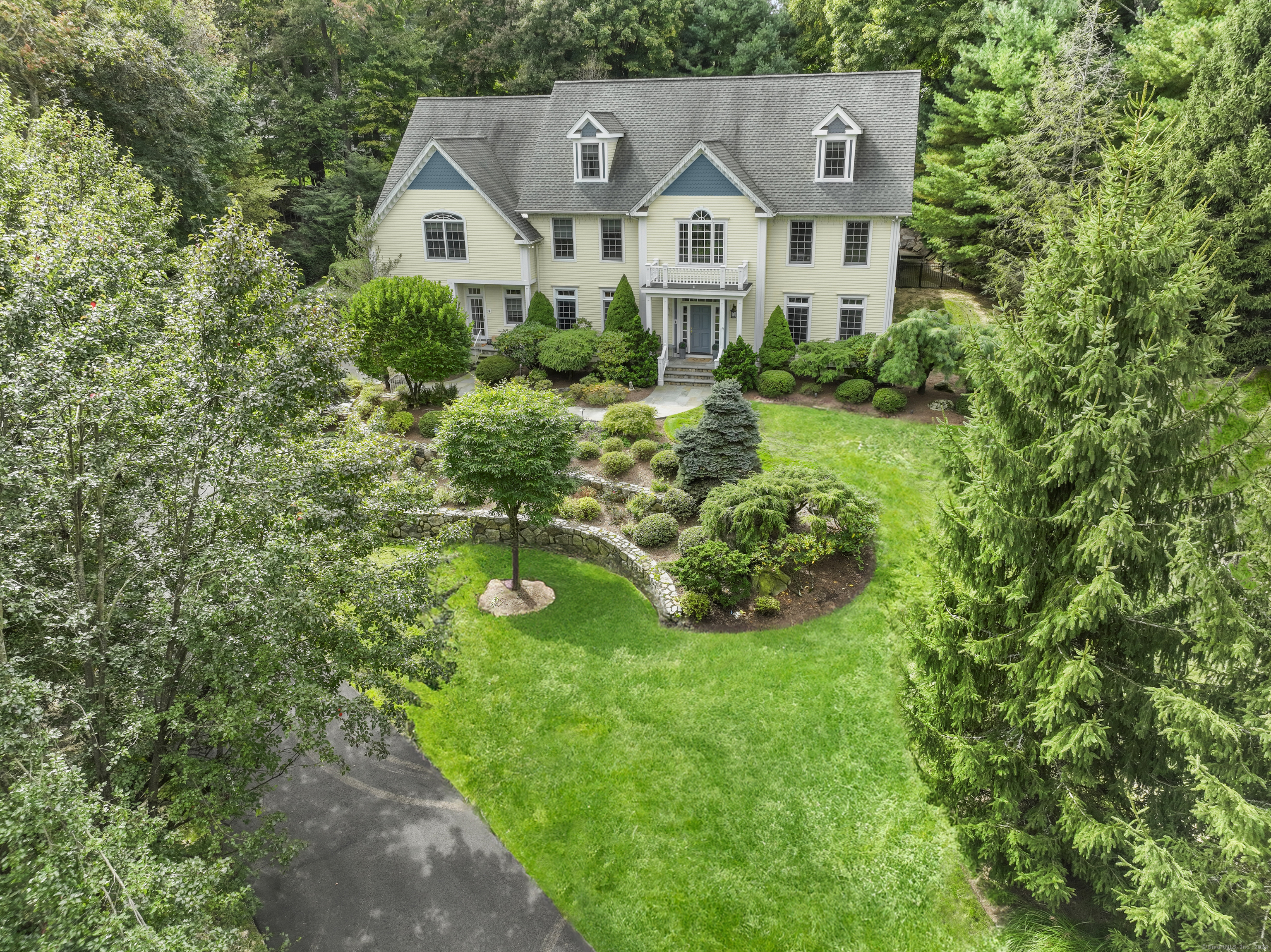 a aerial view of white house with a yard