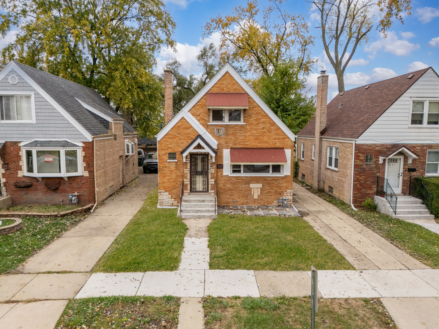 a front view of a house with yard