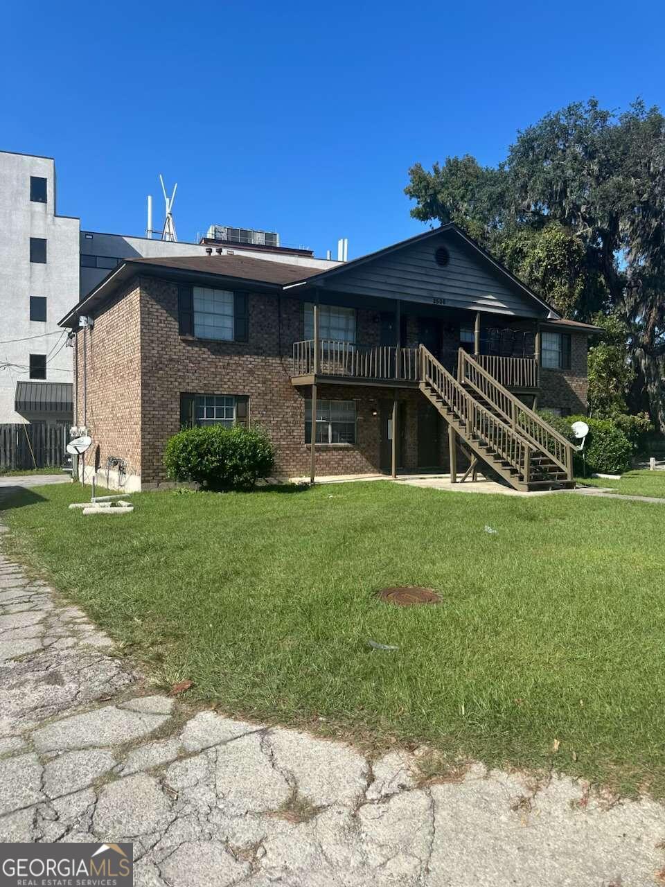 a front view of a house with a yard