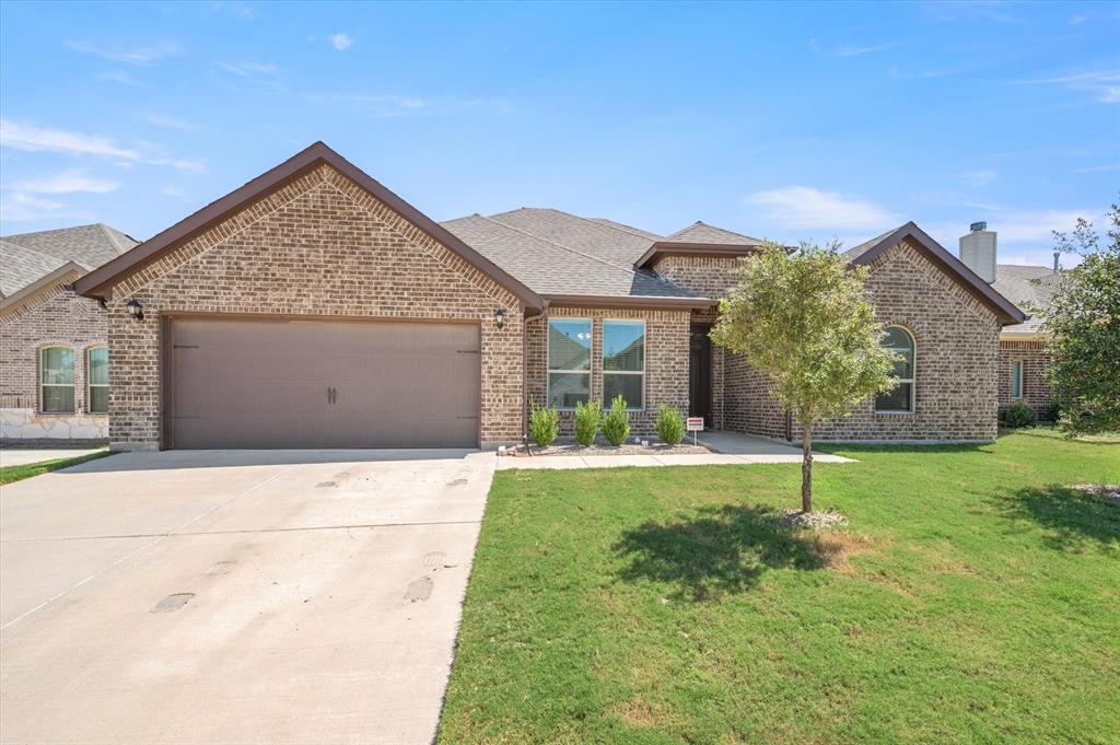 front view of a house with a yard