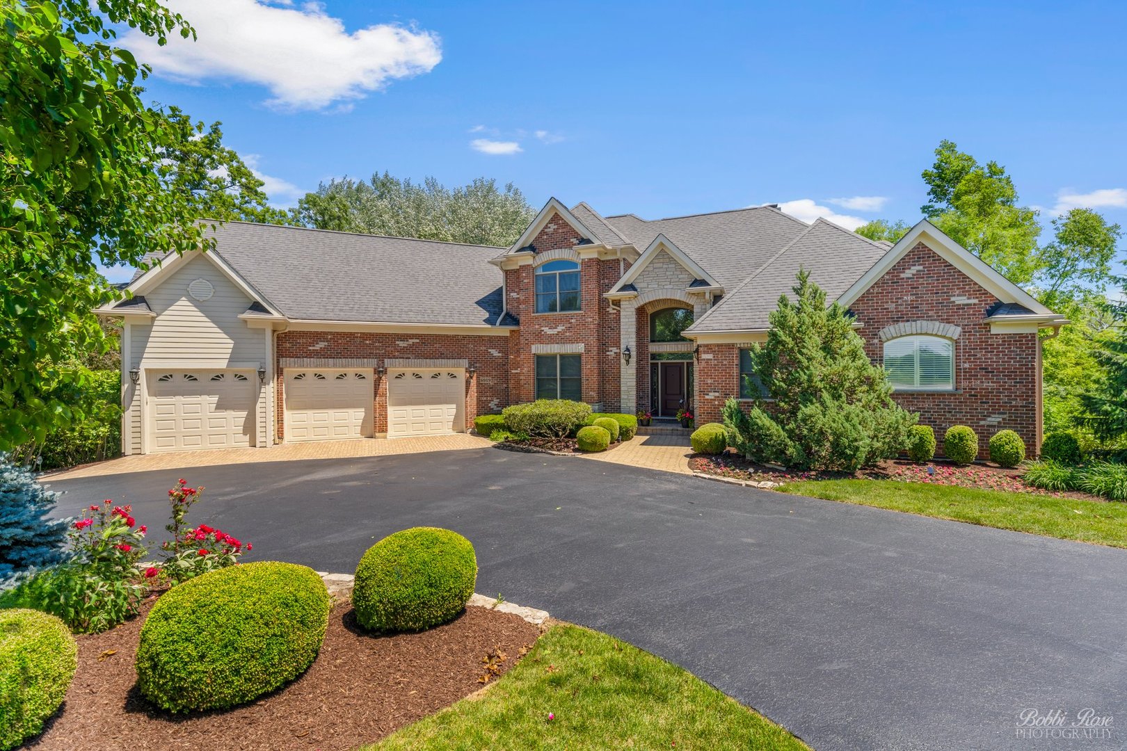 front view of a house with a yard