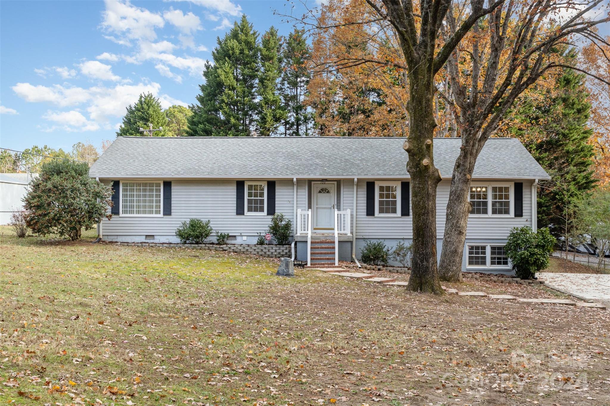 front view of a house with a yard