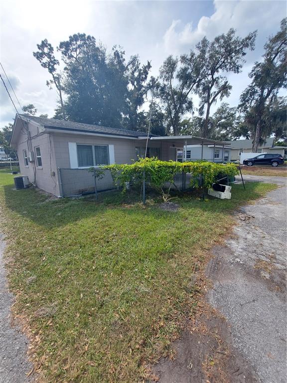 a view of a house with a back yard