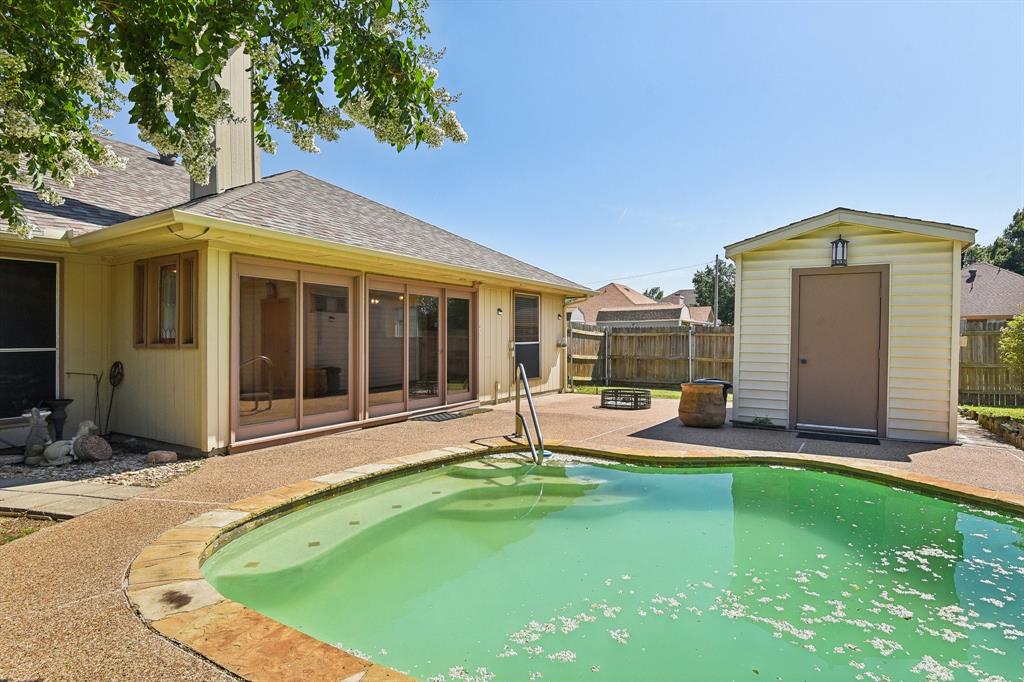 a view of a house with backyard sitting area and garden