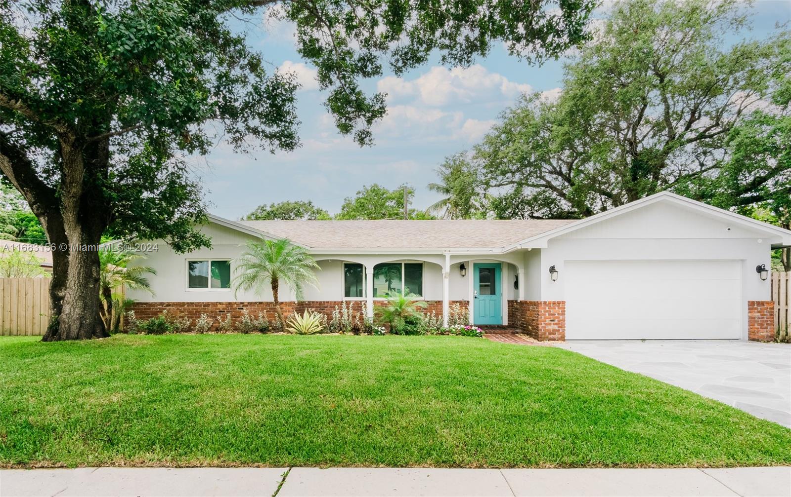 a view of house that has a yard