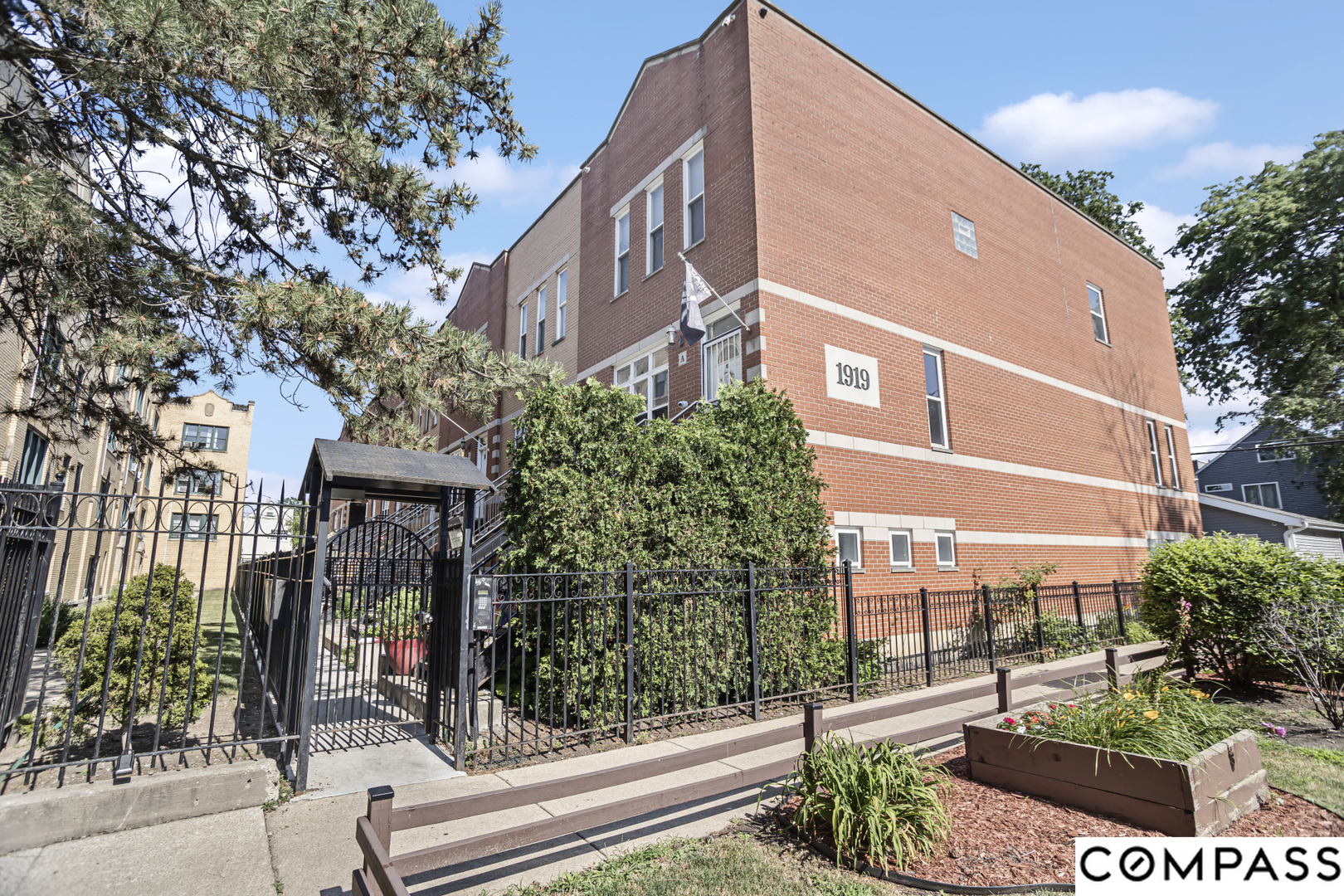 a front view of a building with street view