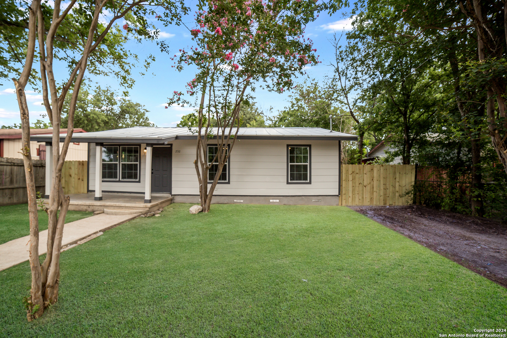 front view of a house with a yard