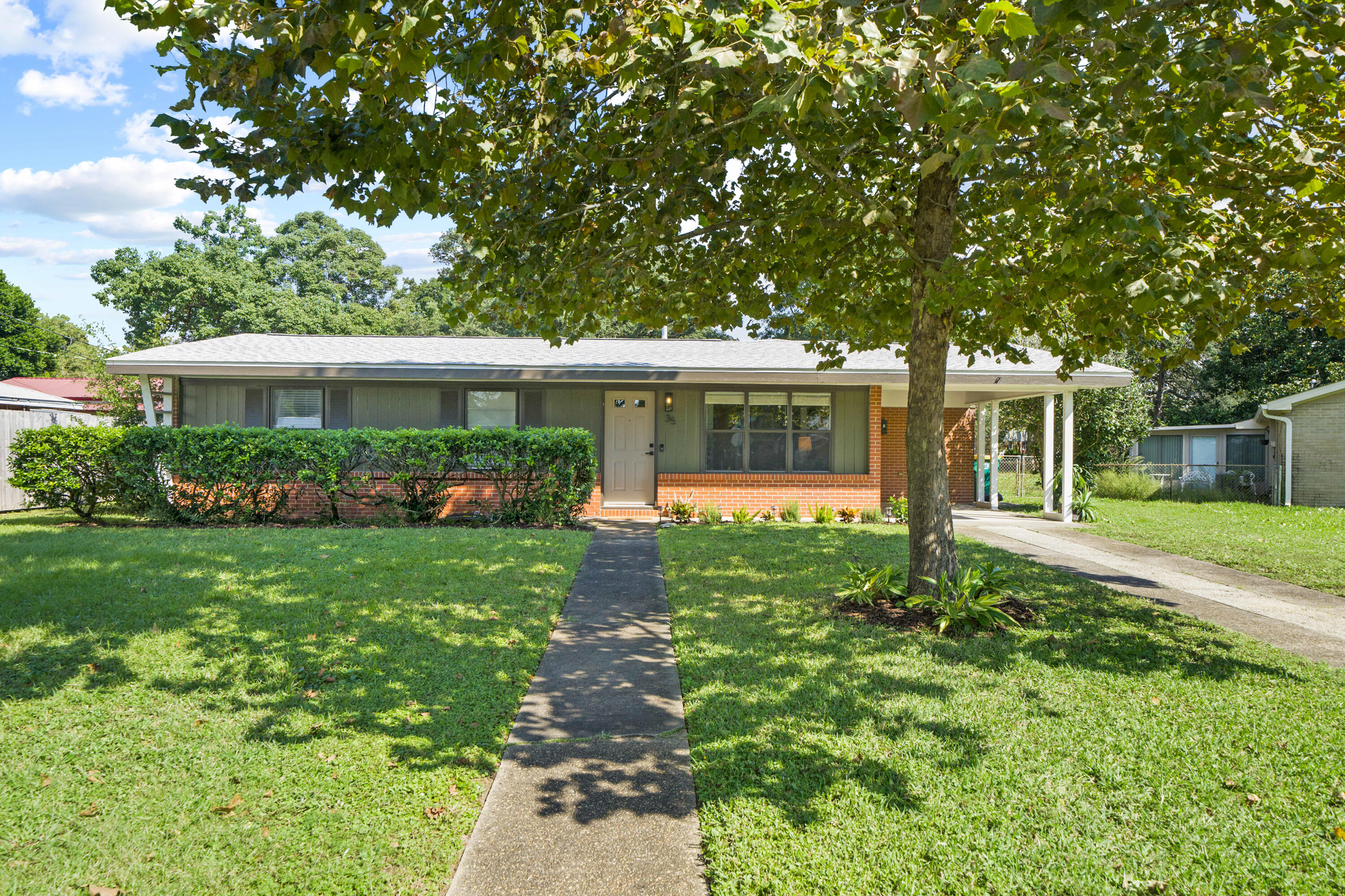 front view of a house with a yard