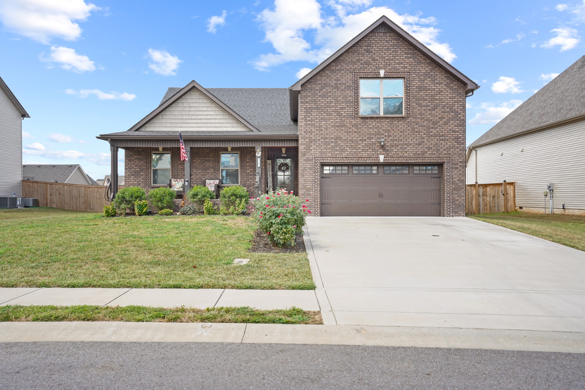 a front view of a house with a yard