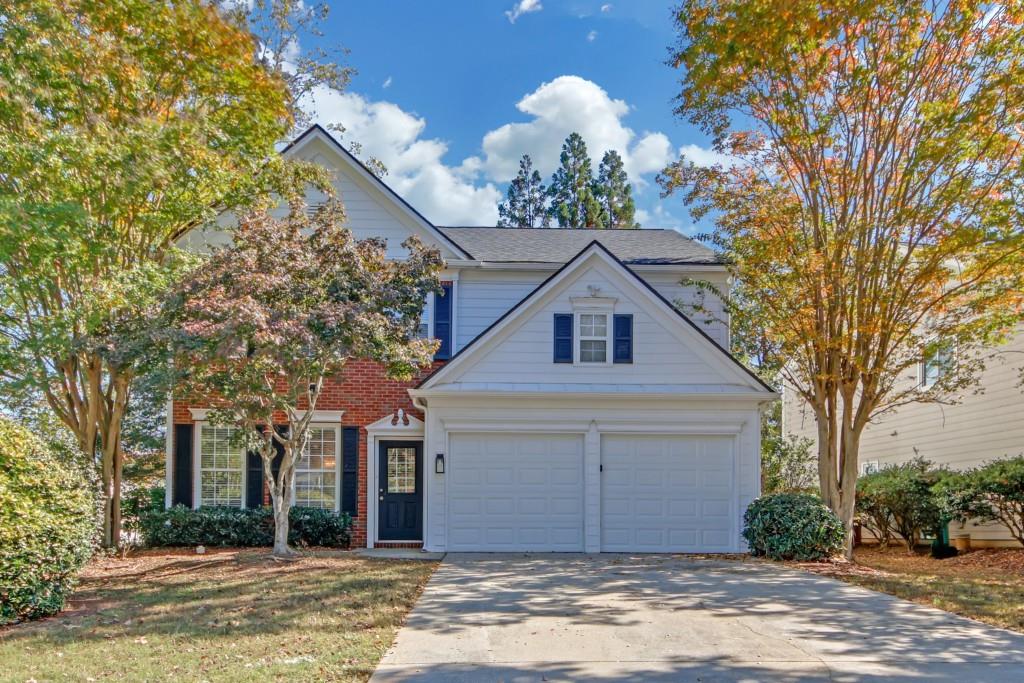 a front view of a house with a yard