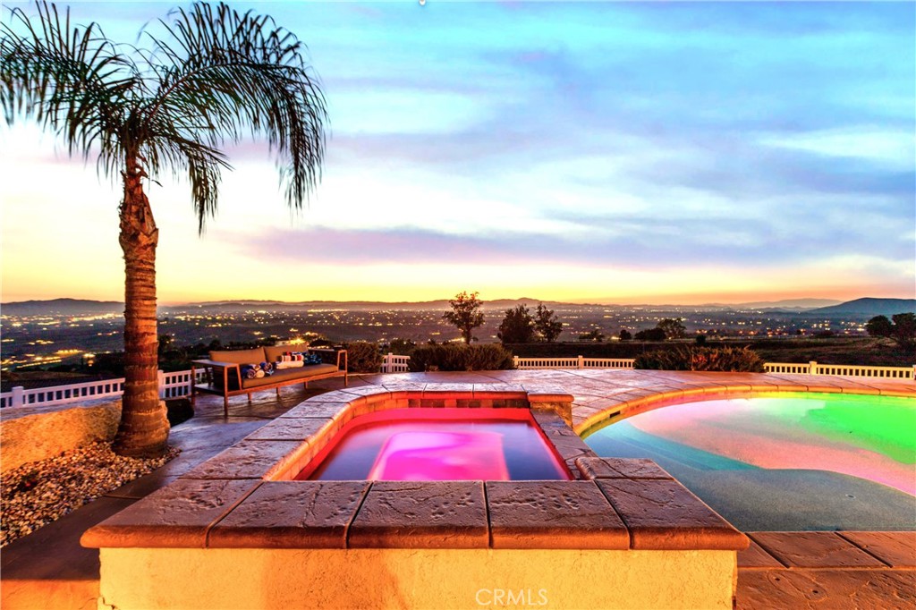 a view of swimming pool with outdoor seating