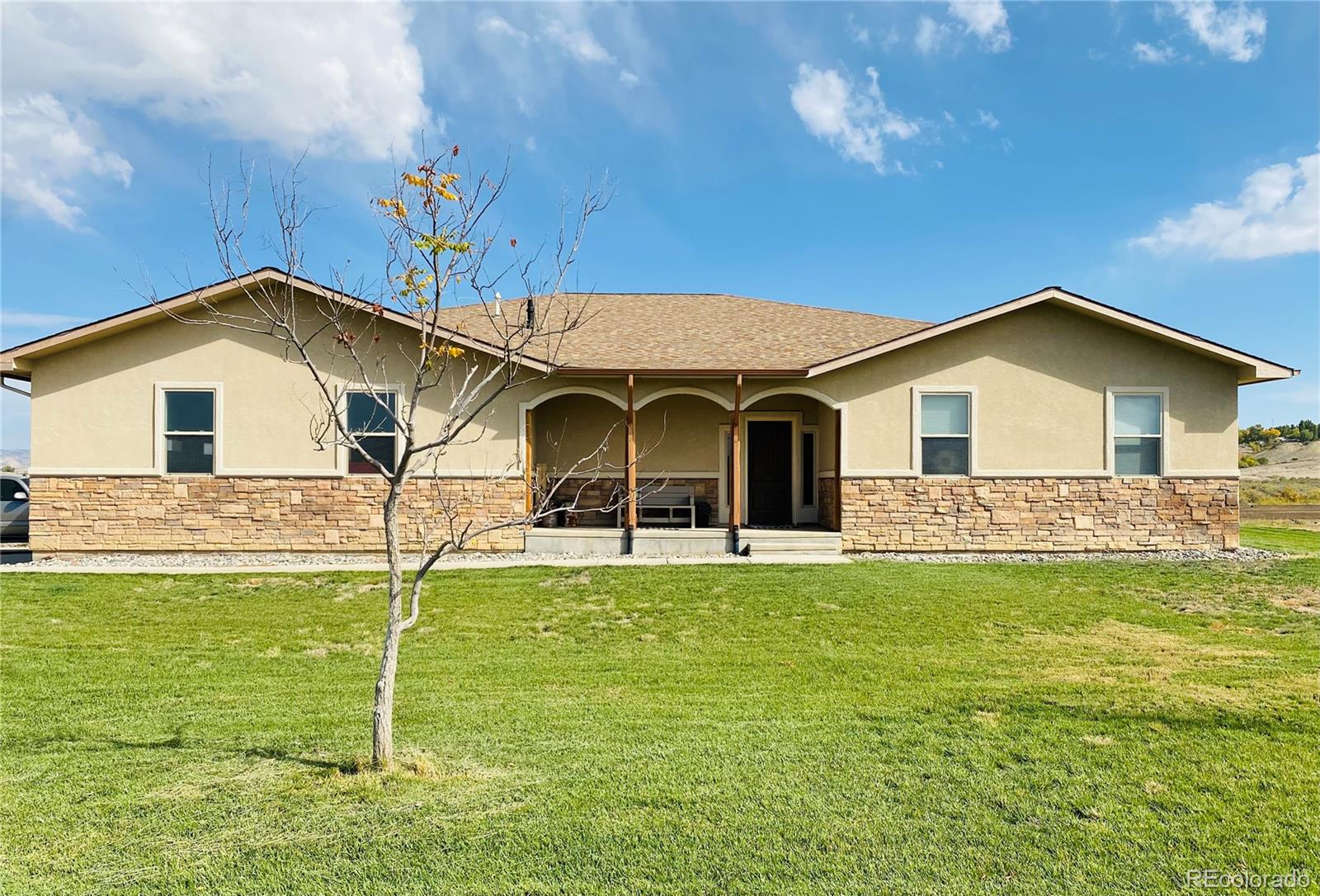 a front view of a house with a yard