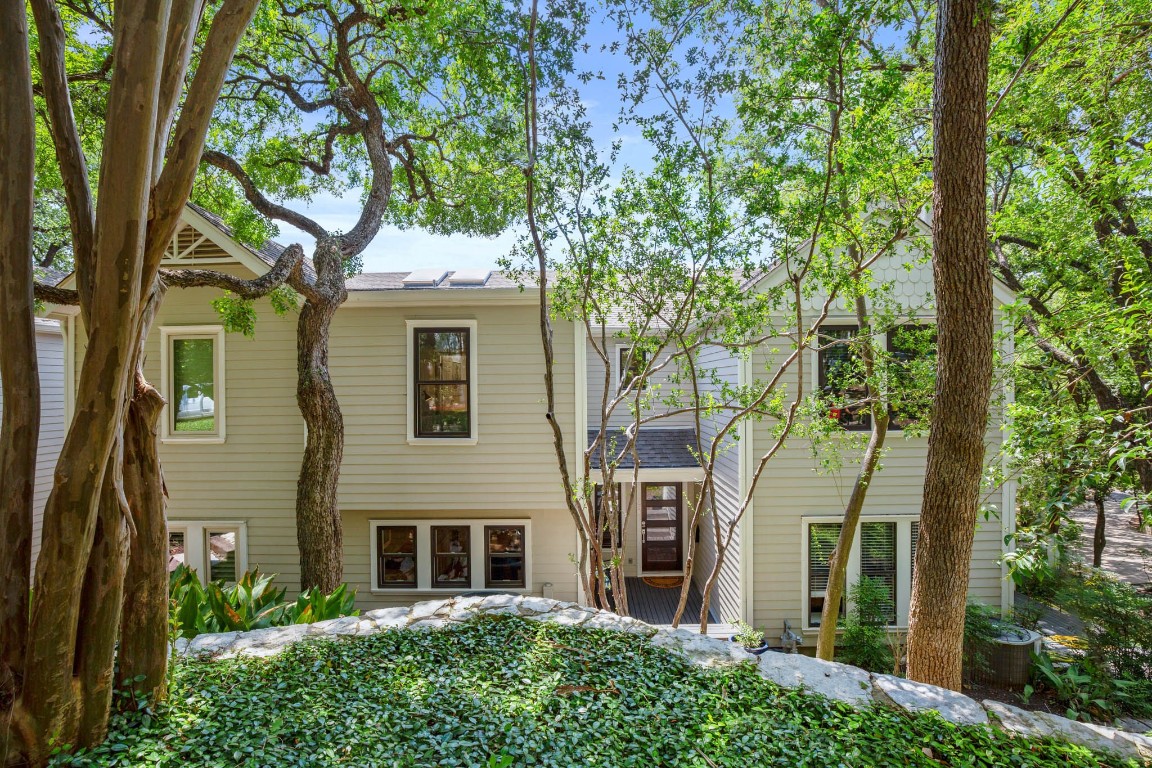 front view of a house with a tree