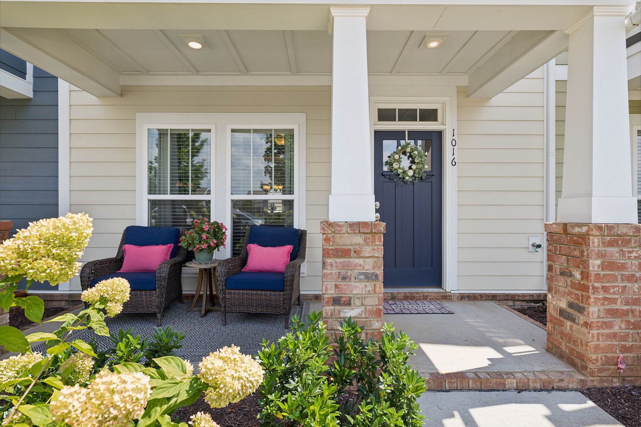 a front view of a house with outdoor seating