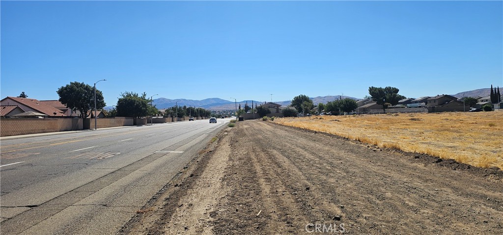 a view of a road with an ocean view