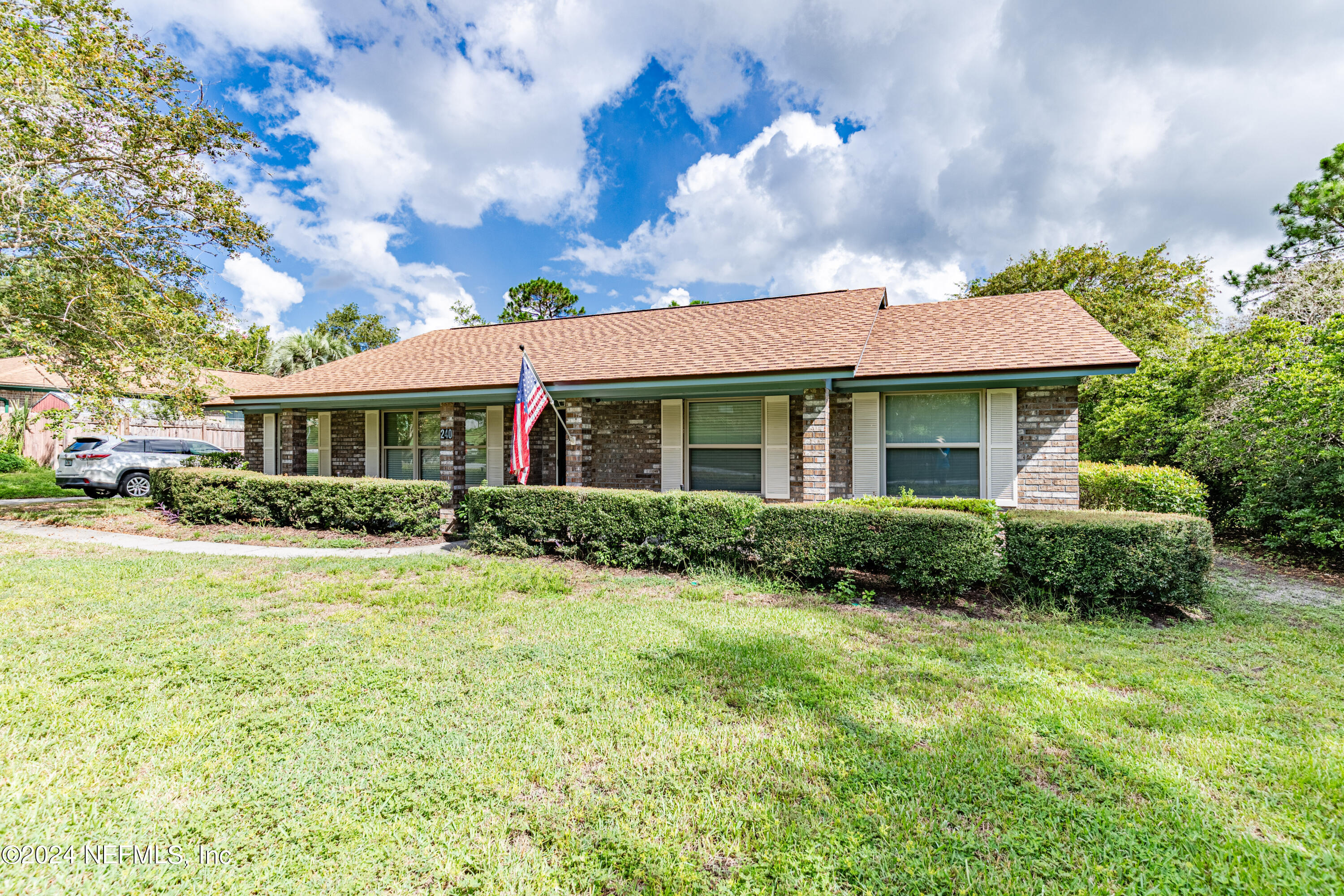 front view of a house and a yard