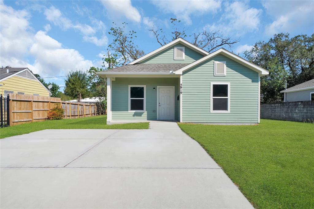 a view of outdoor space yard and front view of house