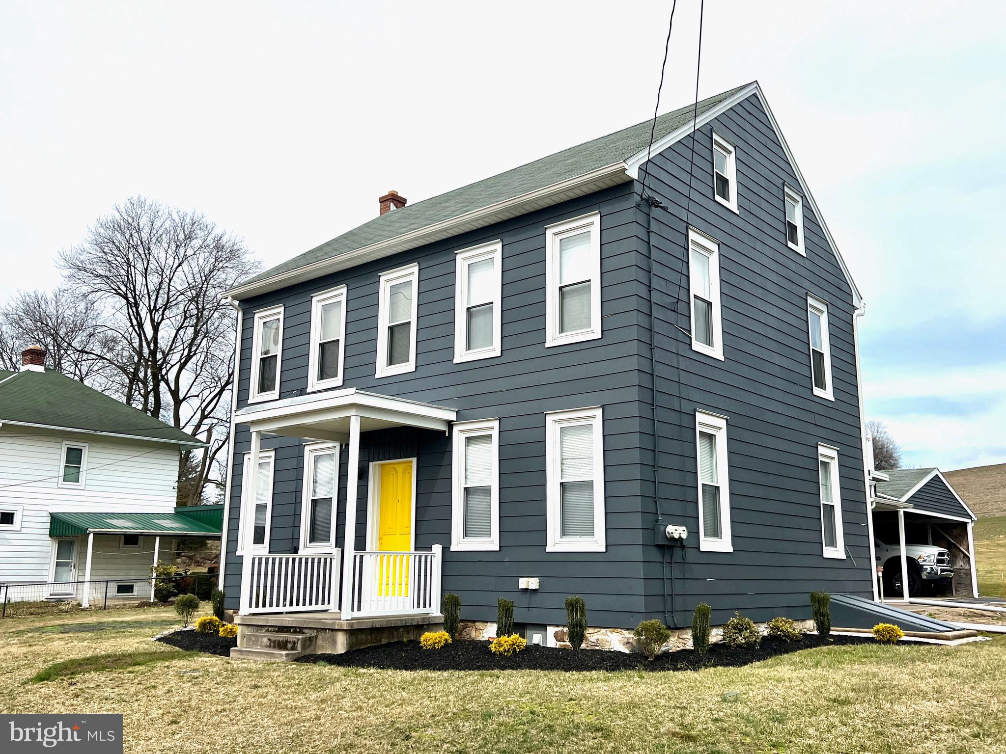 a front view of a house with yard