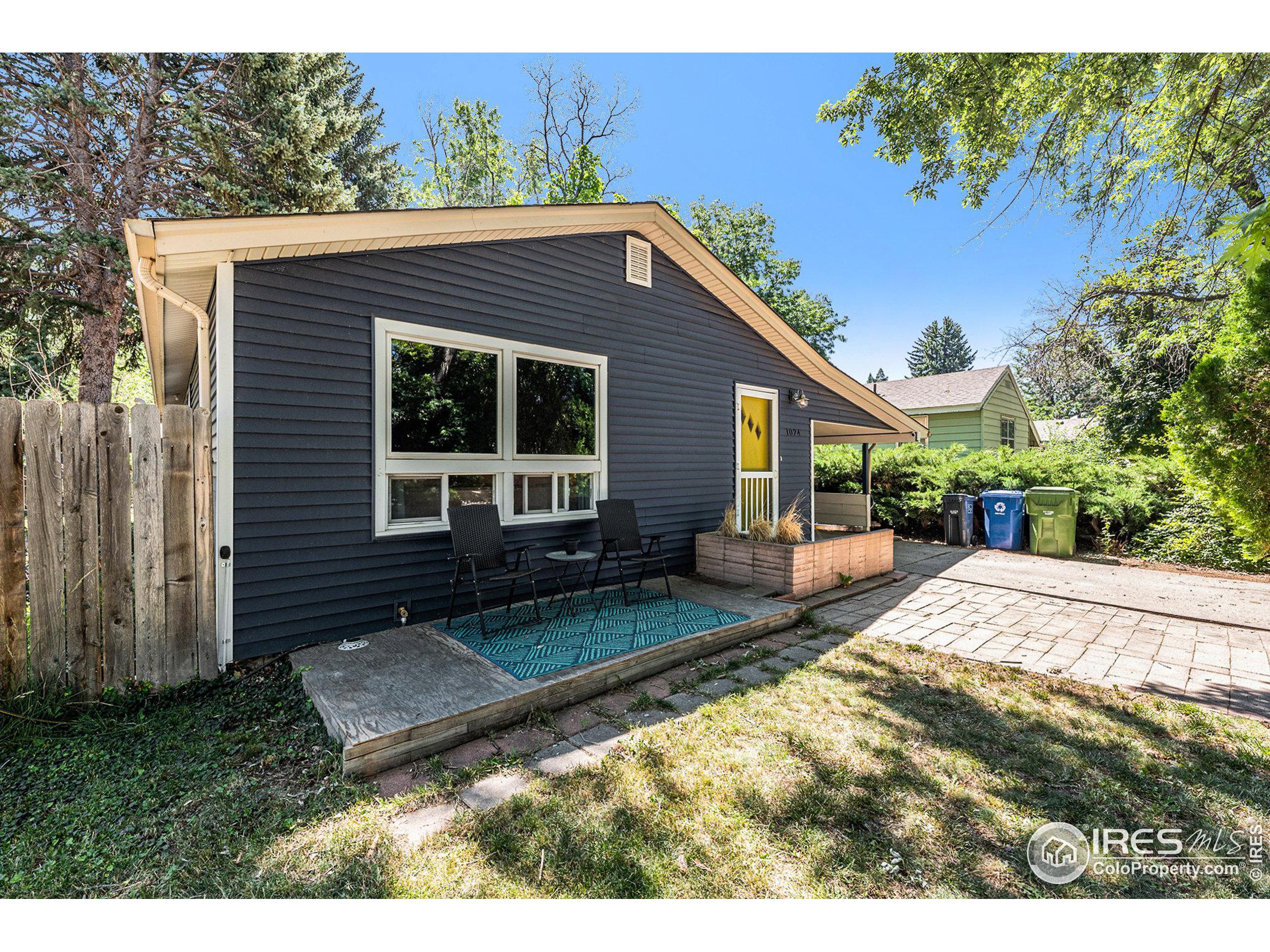 a view of house with backyard and garden