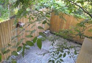 a backyard of a house with lots of green space