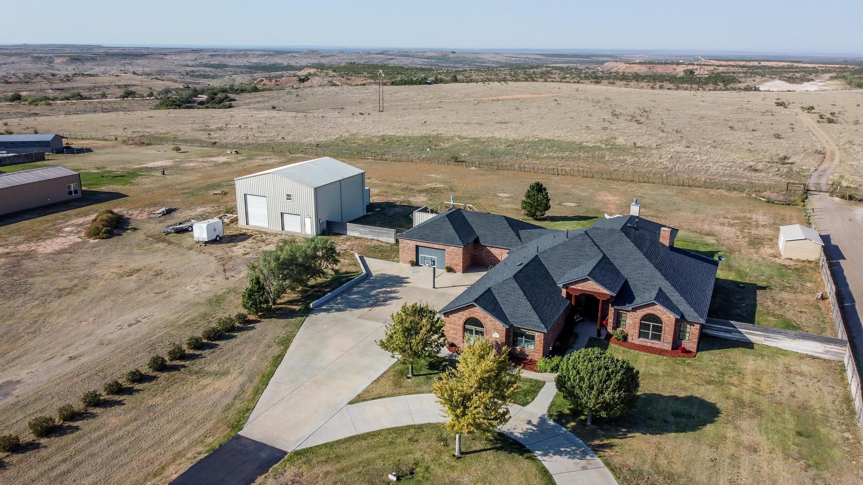 an aerial view of houses with outdoor space