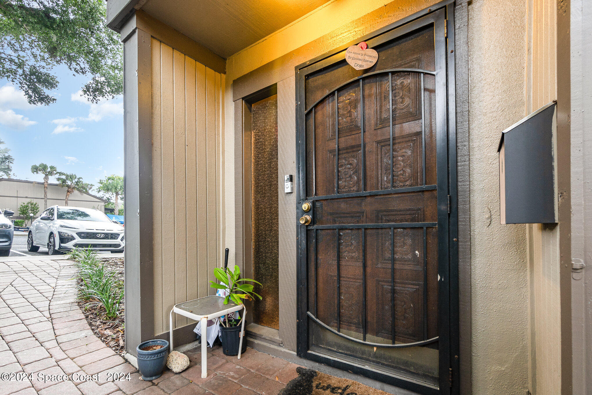 a view of a door and chair in the balcony