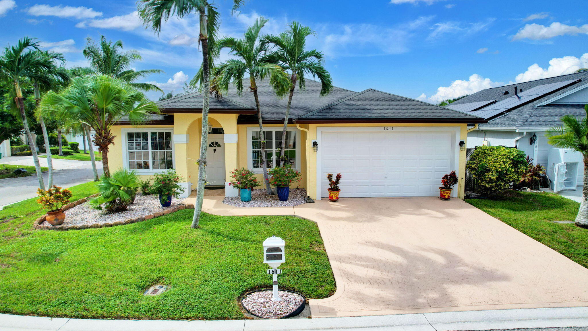 a front view of a house with garden