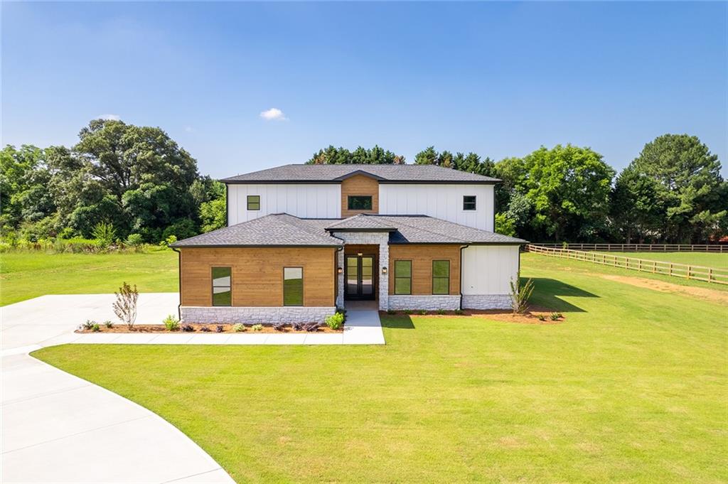 a front view of a house with swimming pool