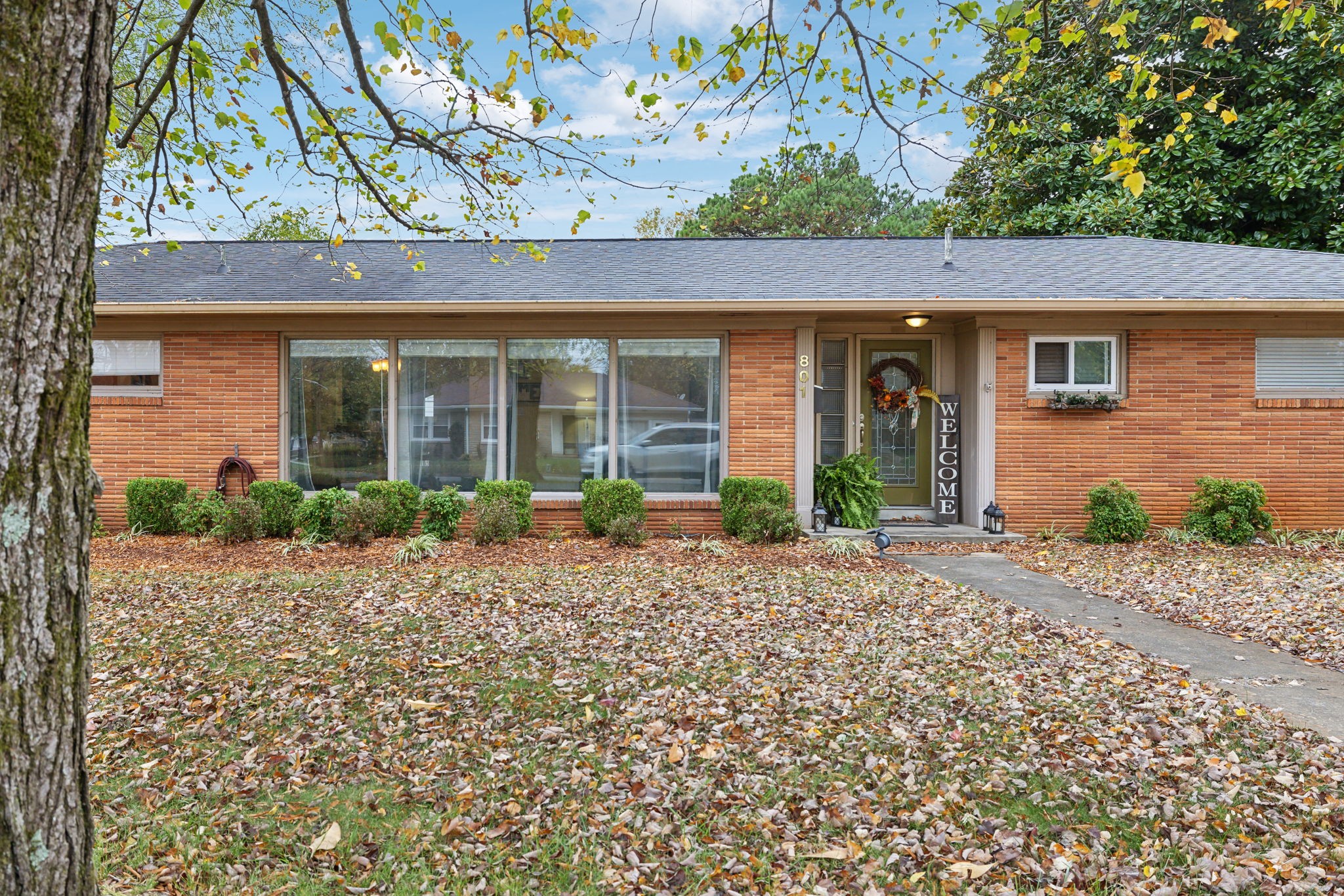 a front view of a house with garden