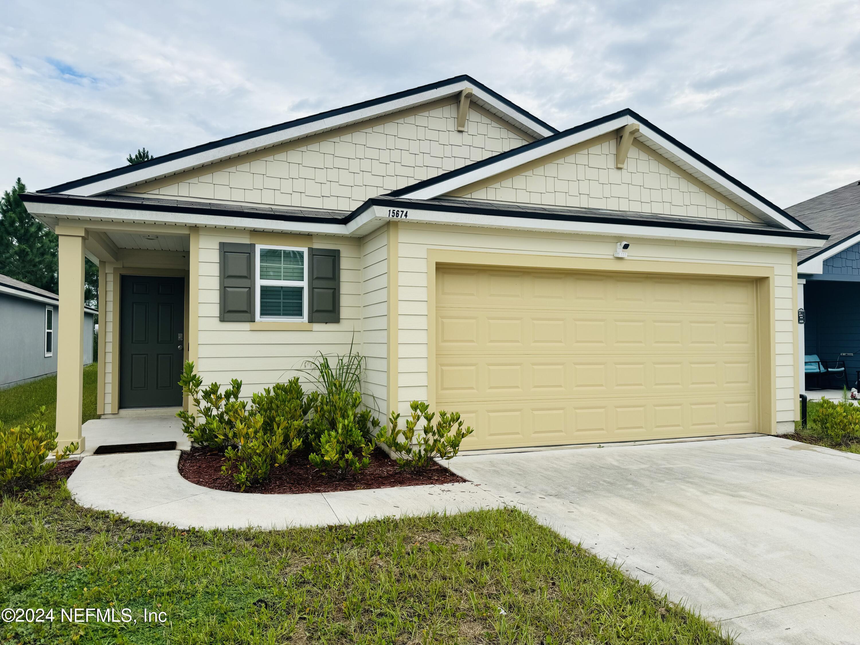 a front view of a house with a yard