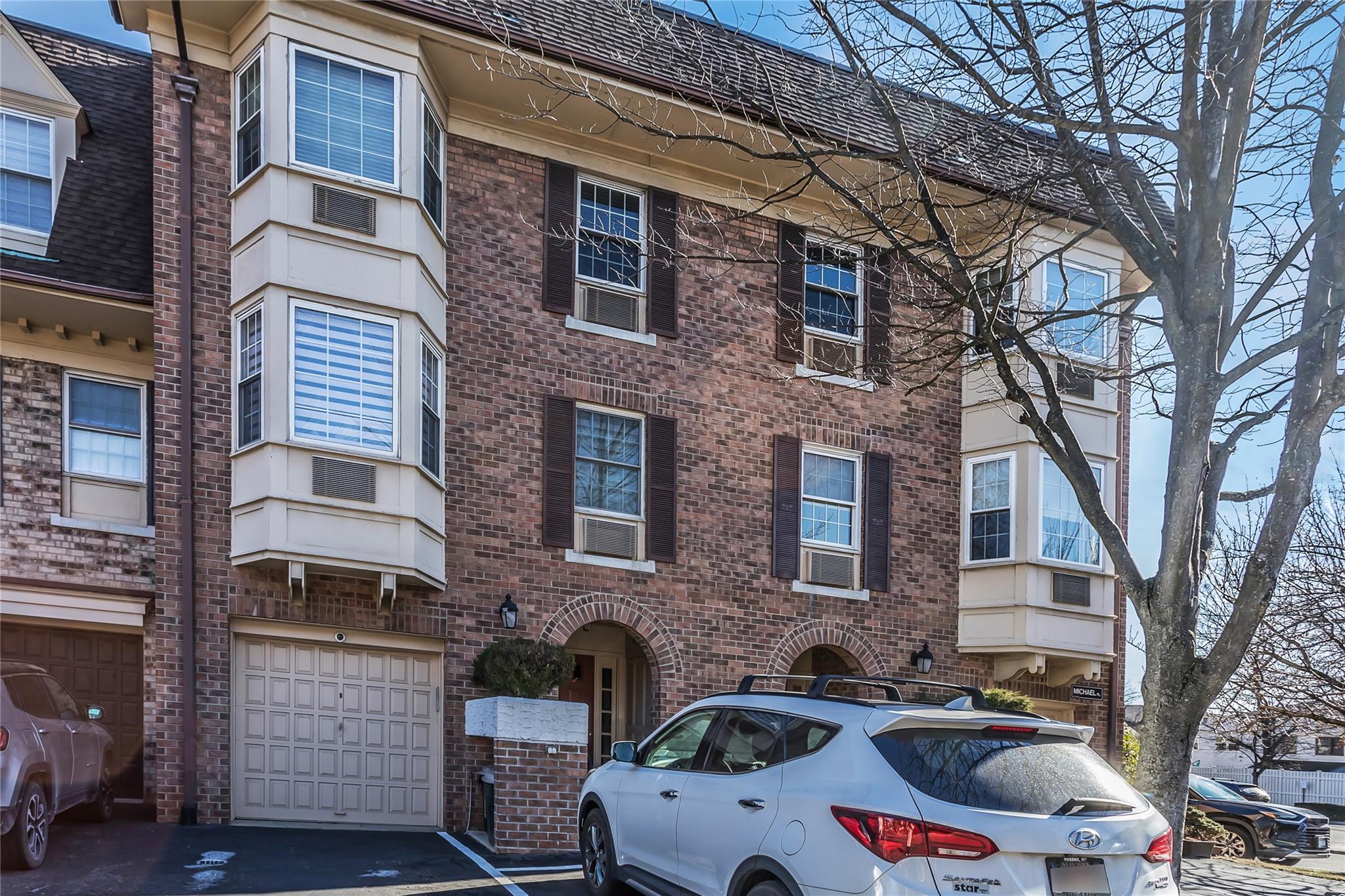 View of property with a garage