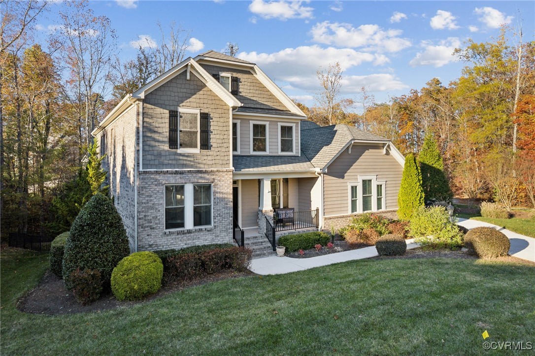 View of front of house featuring covered porch and